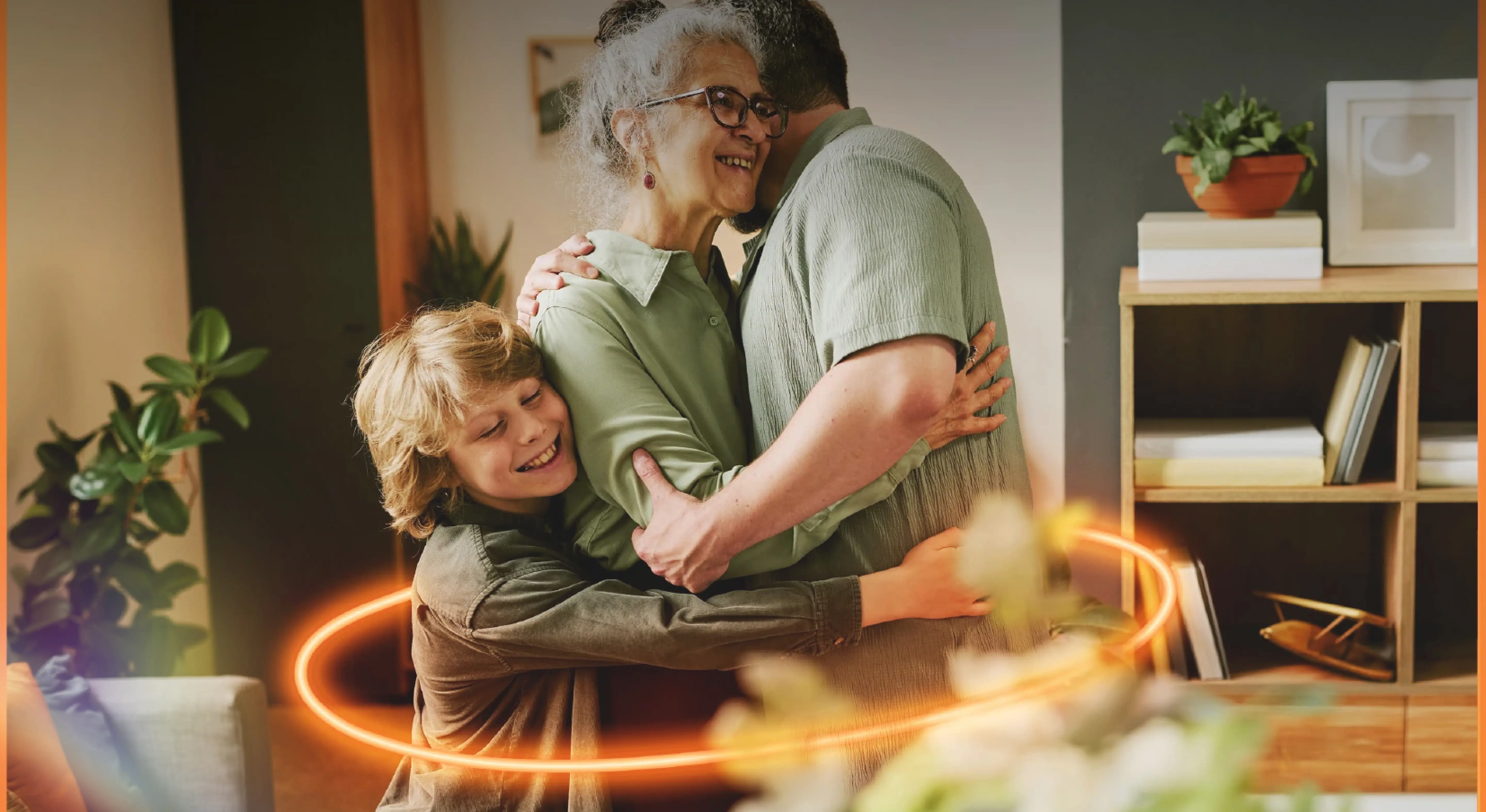 Family of three embracing warmly in a cozy living room. A glowing circle surrounds them, enhancing the loving and joyful atmosphere.